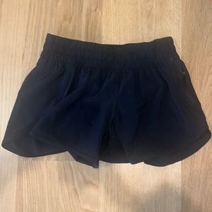 Lululemon black athletic shorts, size 8, with built in underwear + side zipper.